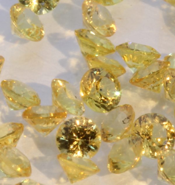 One Yellow Sapphire Well Faceted 2.5 mm Round Accent Gem Averages 0.08 carat.