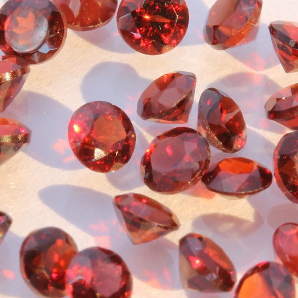 One Deep Red Mozambique Garnet Accent Faceted Round 3 mm Average .15 carat